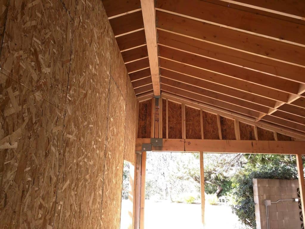 Roof framing under construction by California Bay Builders.
