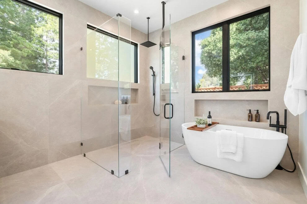 Modern San Francisco bathroom remodel with soaking tub and glass shower by California Bay Builders