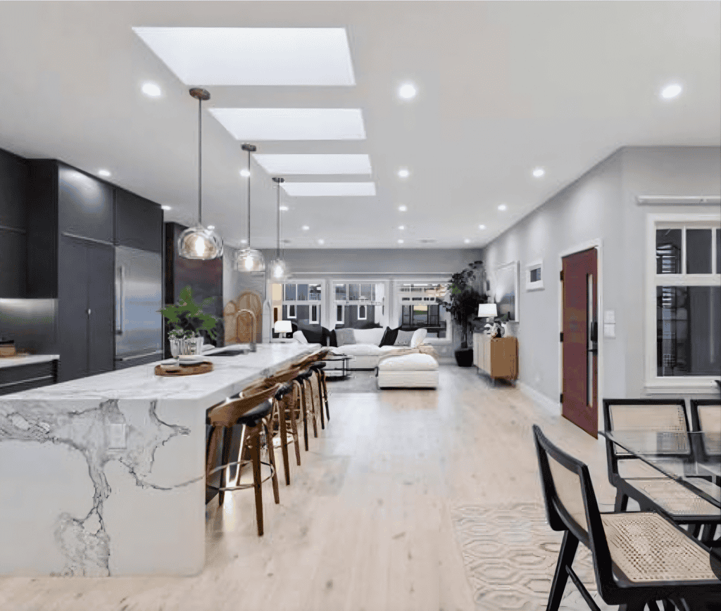 Saratoga whole home renovation modern kitchen with waterfall marble island by California Bay Builders